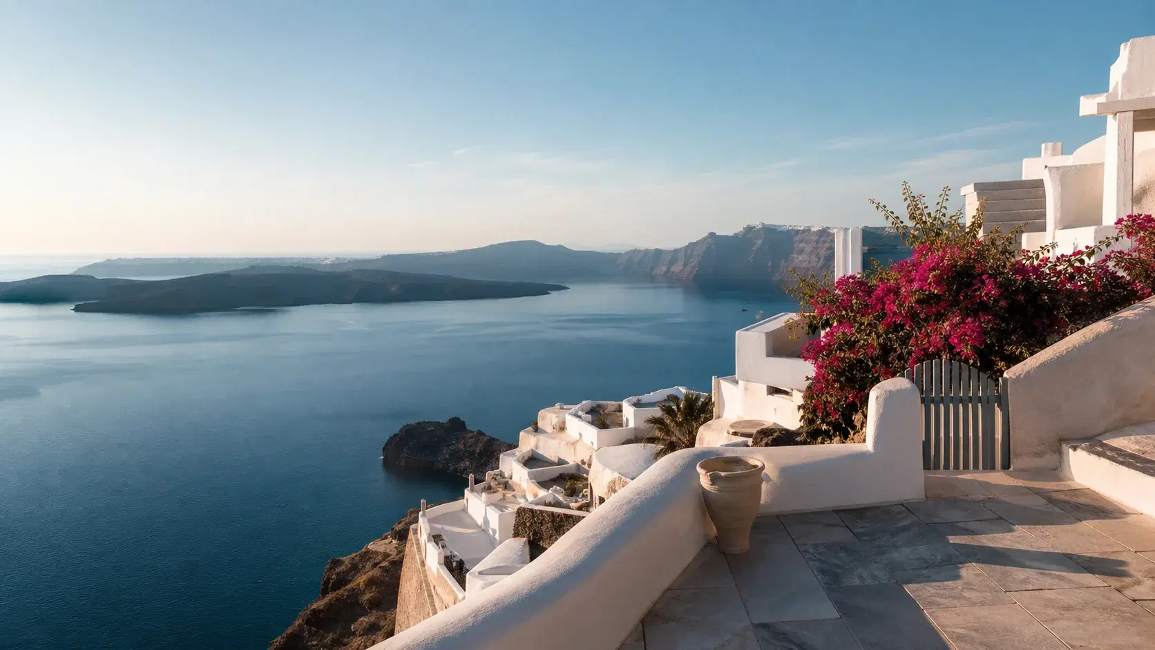 Whitewashed Santorini architecture overlooking the blue Aegean Sea